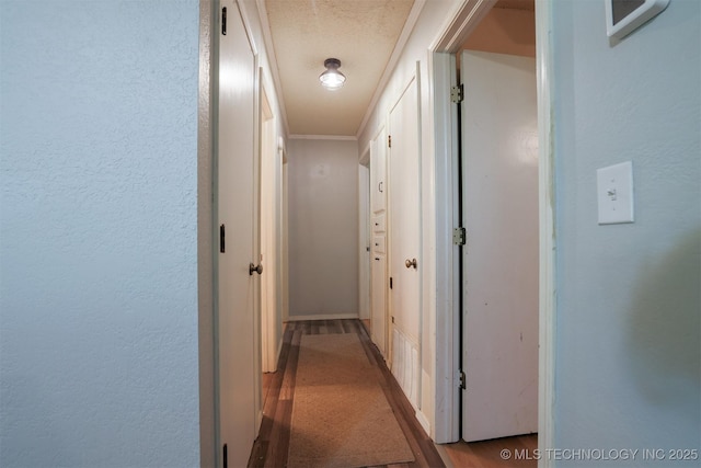 1414 N Eagle Rd, Yale, OK 74085 - hall featuring baseboards, crown molding, and a textured wall