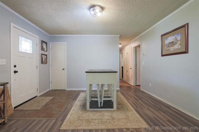 1414 N Eagle Rd, Yale, OK 74085 - foyer entrance with crown molding, a textured ceiling, and dark wood-style floors