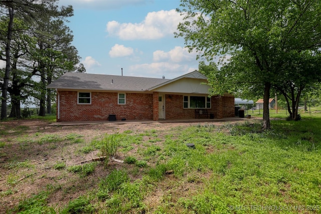 1414 N Eagle Rd, Yale, OK 74085 - rear view of property featuring brick siding
