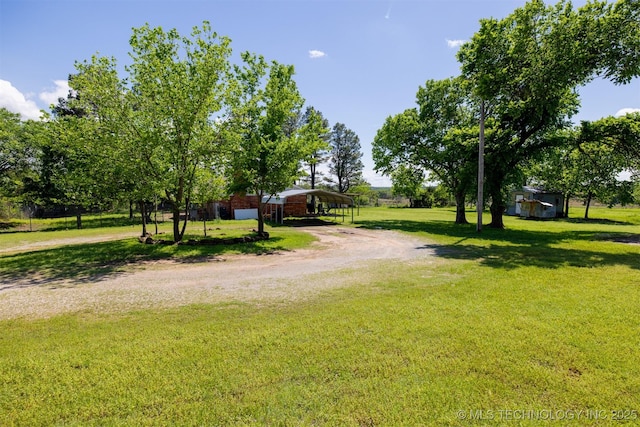 1414 N Eagle Rd, Yale, OK 74085 - view of yard with a detached carport and driveway