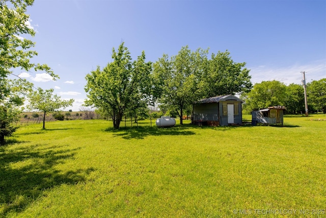 1414 N Eagle Rd, Yale, OK 74085 - view of yard featuring a storage shed and an outbuilding