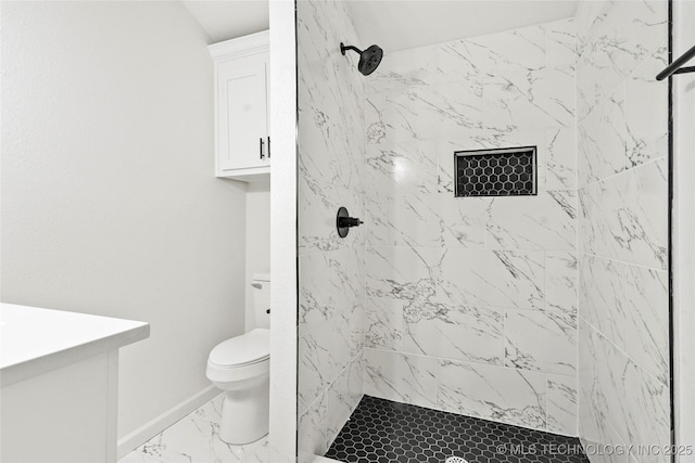 full bathroom with toilet, baseboards, marble finish floor, and a stall shower