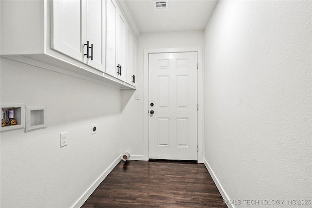 laundry room with visible vents, hookup for an electric dryer, baseboards, cabinet space, and dark wood-style flooring
