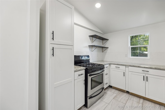 1910 E Marshall Pl, Tulsa, OK 74110 - kitchen with stainless steel gas range, open shelves, vaulted ceiling, white cabinets, and light stone counters