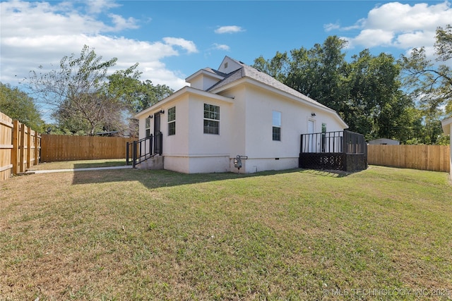 1910 E Marshall Pl, Tulsa, OK 74110 - rear view of house with stucco siding and crawl space