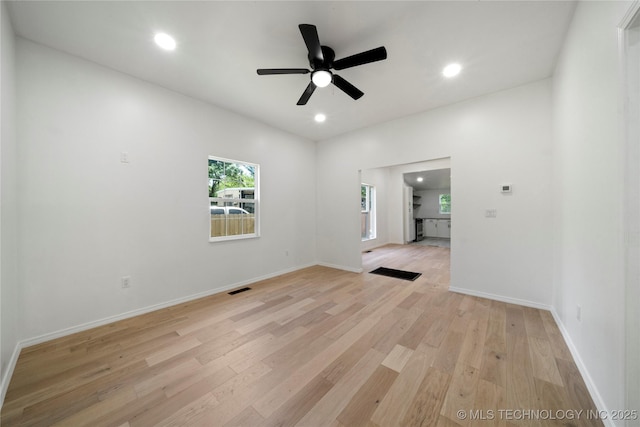 1910 E Marshall Pl, Tulsa, OK 74110 - spare room featuring a ceiling fan, light wood-type flooring, recessed lighting, and baseboards
