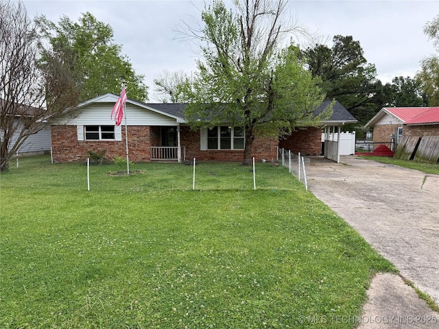 713 6th Ave, Warner, OK 74469 - single story home featuring brick siding, a front yard, concrete driveway, and fence