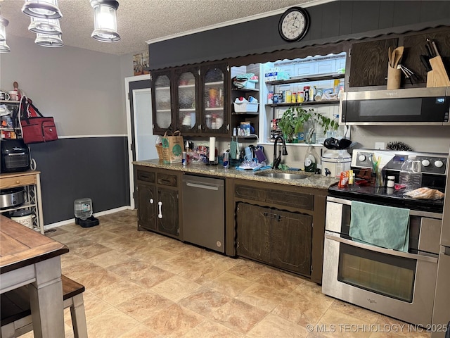 713 6th Ave, Warner, OK 74469 - kitchen with dark brown cabinets, a sink, a textured ceiling, and appliances with stainless steel finishes
