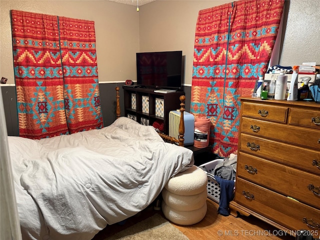 713 6th Ave, Warner, OK 74469 - bedroom featuring wood finished floors