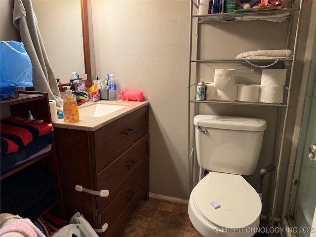 713 6th Ave, Warner, OK 74469 - bathroom with baseboards, vanity, and toilet