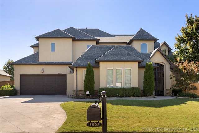 5905 W Charleston St, Broken Arrow, OK 74011 - traditional home with stucco siding, roof with shingles, concrete driveway, and a front yard