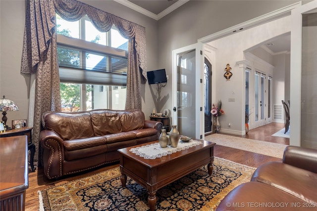 5905 W Charleston St, Broken Arrow, OK 74011 - living room featuring plenty of natural light, wood finished floors, and crown molding