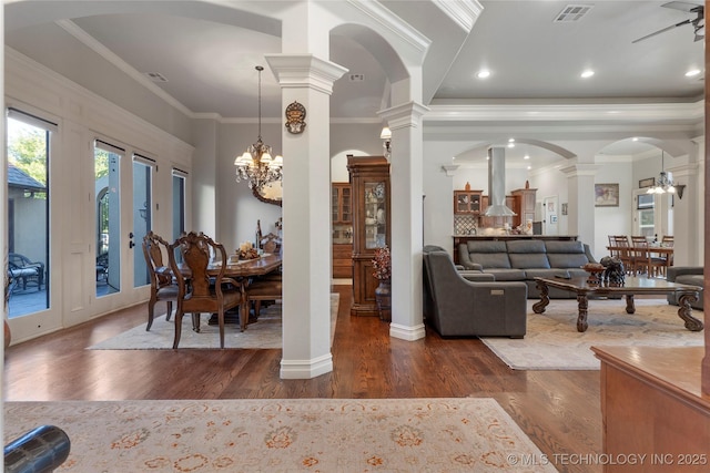 5905 W Charleston St, Broken Arrow, OK 74011 - dining room featuring visible vents, an inviting chandelier, ornate columns, dark wood-type flooring, and ornamental molding