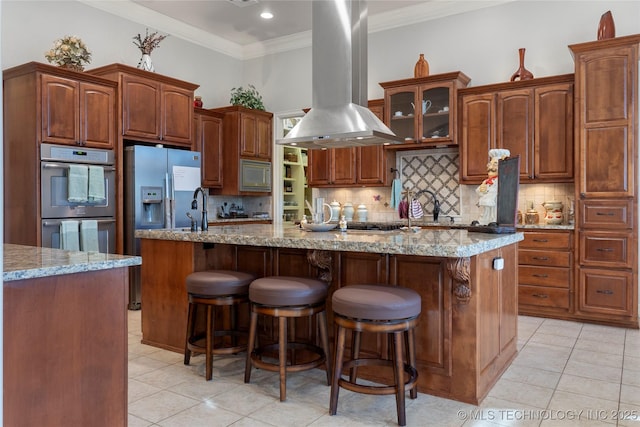 5905 W Charleston St, Broken Arrow, OK 74011 - kitchen featuring island exhaust hood, ornamental molding, stainless steel appliances, and light tile patterned floors
