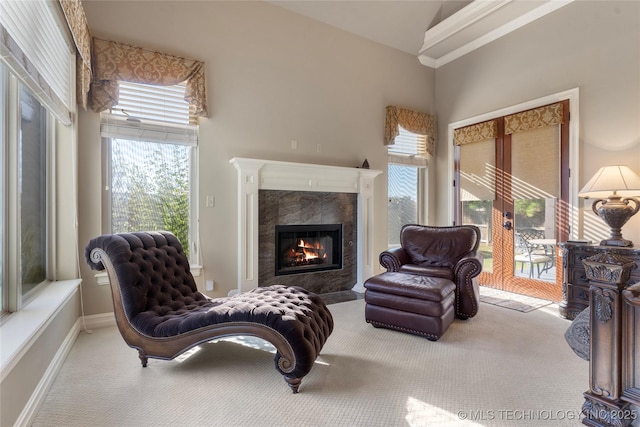 5905 W Charleston St, Broken Arrow, OK 74011 - sitting room featuring a tiled fireplace, baseboards, carpet floors, and crown molding