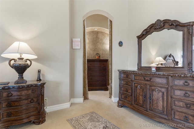 5905 W Charleston St, Broken Arrow, OK 74011 - hall with light carpet, baseboards, and arched walkways