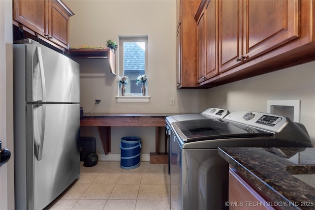 5905 W Charleston St, Broken Arrow, OK 74011 - laundry room featuring washing machine and clothes dryer, baseboards, and light tile patterned floors