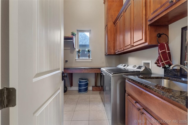 5905 W Charleston St, Broken Arrow, OK 74011 - washroom featuring a sink, separate washer and dryer, light tile patterned floors, cabinet space, and baseboards