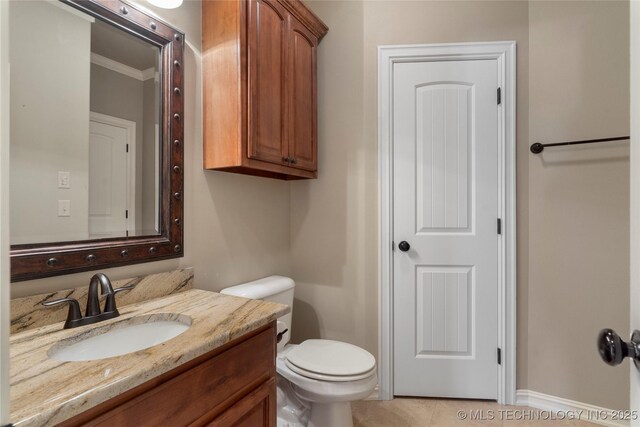 5905 W Charleston St, Broken Arrow, OK 74011 - bathroom featuring tile patterned floors, toilet, baseboards, crown molding, and vanity