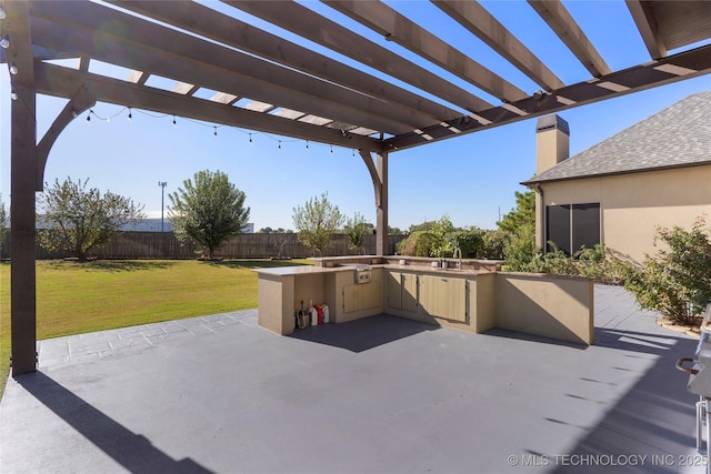 5905 W Charleston St, Broken Arrow, OK 74011 - view of patio with an outdoor kitchen, a sink, a grill, fence, and a pergola