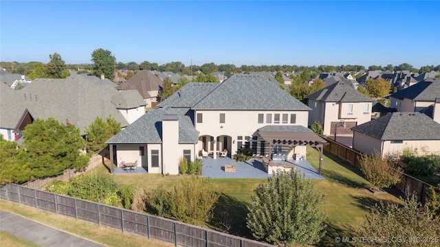 5905 W Charleston St, Broken Arrow, OK 74011 - exterior space with a front lawn, a residential view, a fenced backyard, and a patio