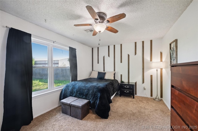 115 Aspen Dr, Mannford, OK 74044 - carpeted bedroom featuring a ceiling fan, baseboards, and a textured ceiling