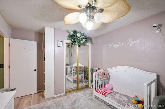 115 Aspen Dr, Mannford, OK 74044 - bedroom featuring ceiling fan, light wood-style floors, and a closet