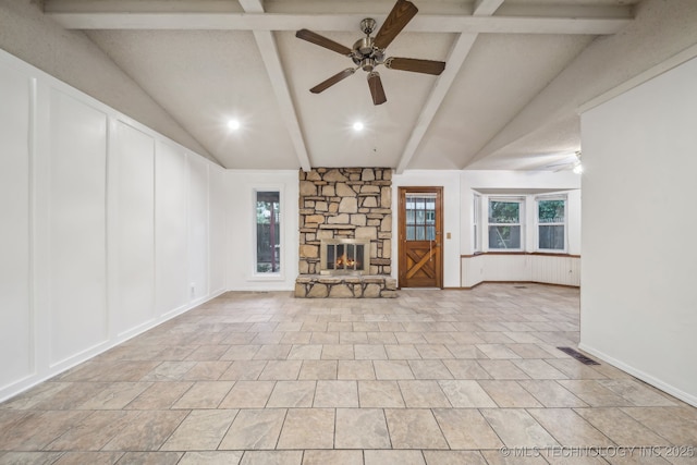 3316 S Ash Pl, Broken Arrow, OK 74012 - unfurnished living room with visible vents, a decorative wall, a fireplace, vaulted ceiling with beams, and a ceiling fan