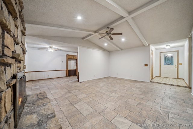 3316 S Ash Pl, Broken Arrow, OK 74012 - unfurnished living room with wainscoting, a fireplace, a ceiling fan, and a textured ceiling
