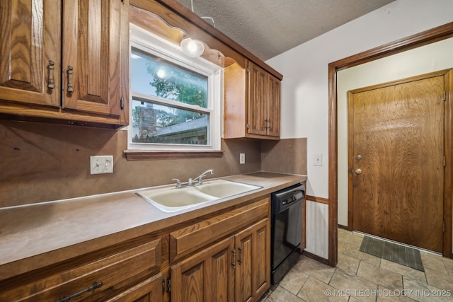 3316 S Ash Pl, Broken Arrow, OK 74012 - kitchen featuring a textured ceiling, brown cabinetry, a sink, and dishwasher