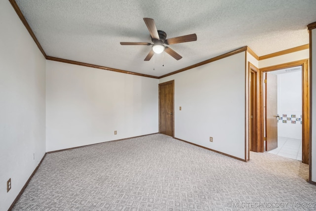 3316 S Ash Pl, Broken Arrow, OK 74012 - carpeted spare room featuring baseboards, ceiling fan, ornamental molding, and a textured ceiling