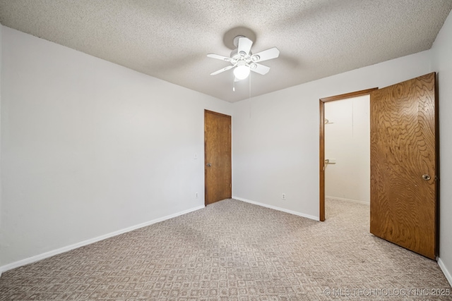 3316 S Ash Pl, Broken Arrow, OK 74012 - unfurnished bedroom with a textured ceiling, ceiling fan, baseboards, and carpet