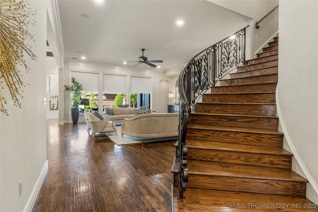 4416 S Orange Ave, Broken Arrow, OK 74011 - living room featuring stairway, ceiling fan, arched walkways, and wood finished floors