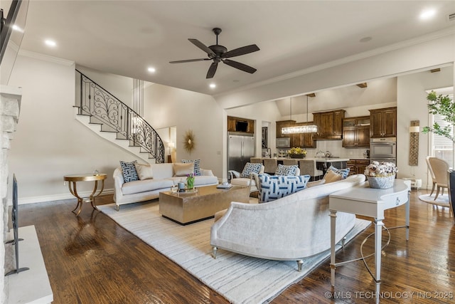 4416 S Orange Ave, Broken Arrow, OK 74011 - living room with dark wood finished floors, baseboards, stairway, crown molding, and ceiling fan
