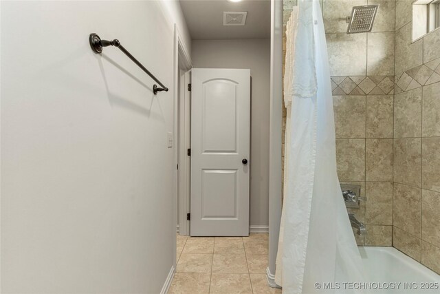 4416 S Orange Ave, Broken Arrow, OK 74011 - bathroom featuring visible vents, tile patterned floors, baseboards, and shower / bath combination with curtain
