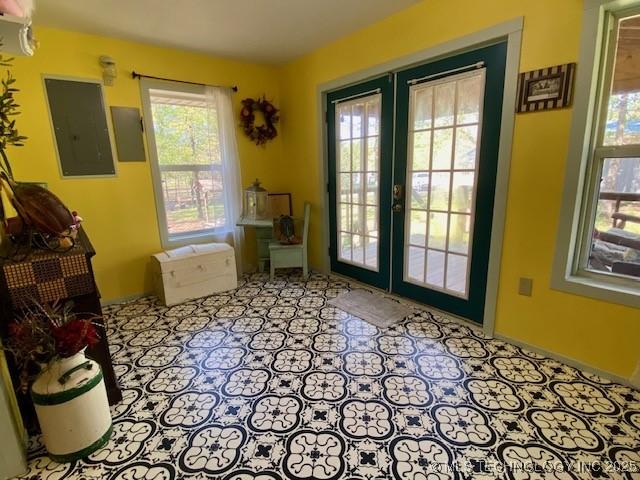 doorway to outside with french doors and electric panel