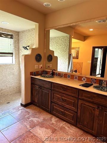 bathroom with visible vents, tile patterned floors, and vanity