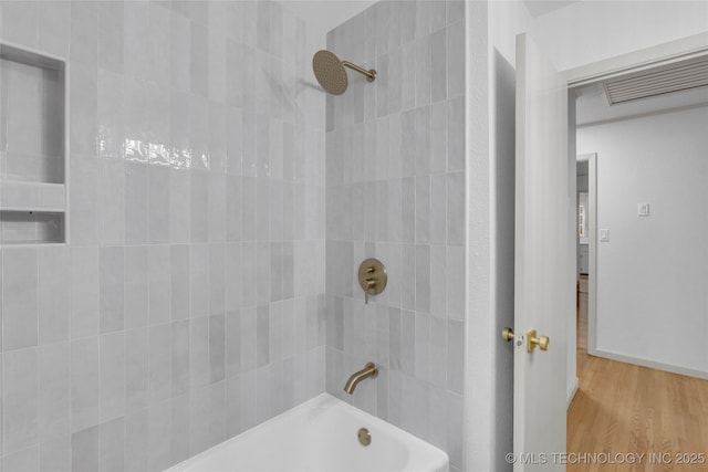 3644 S Louisville Ave, Tulsa, OK 74135 - bathroom with wood finished floors and shower / bathtub combination