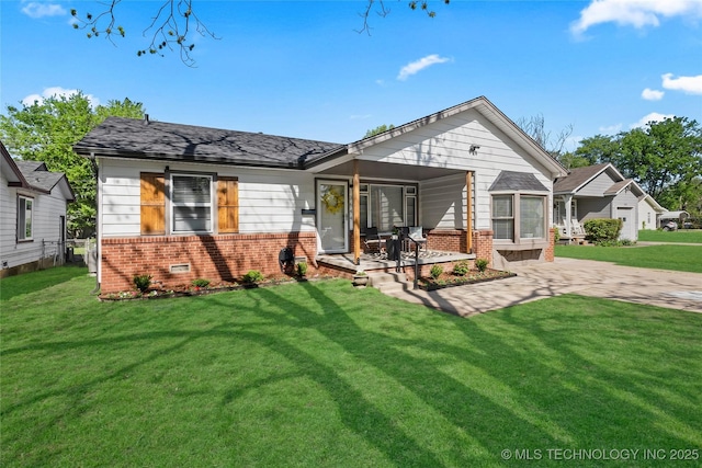 3644 S Louisville Ave, Tulsa, OK 74135 - rear view of house featuring brick siding and a yard
