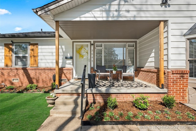 3644 S Louisville Ave, Tulsa, OK 74135 - property entrance featuring brick siding, a porch, and a lawn