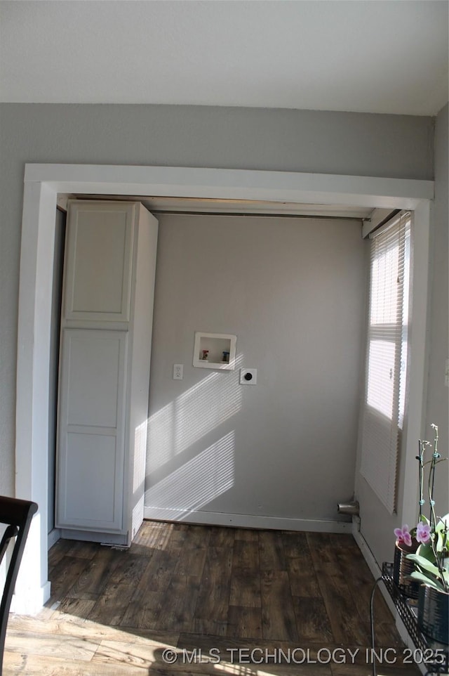 washroom with hardwood / wood-style flooring, electric dryer hookup, hookup for a washing machine, and laundry area