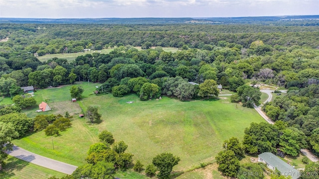 bird's eye view featuring a forest view