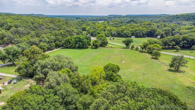 drone / aerial view with a view of trees