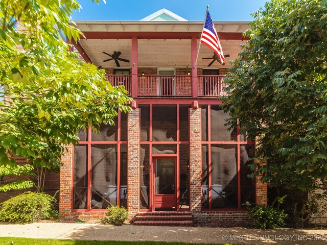 31 Park St, Carlton Landing, OK 74432 - property entrance with brick siding, a balcony, and ceiling fan