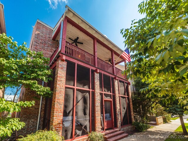 31 Park St, Carlton Landing, OK 74432 - rear view of property with a ceiling fan, a balcony, and brick siding