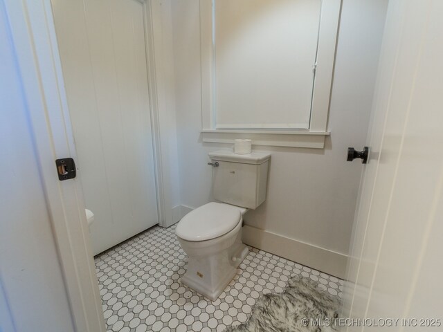 31 Park St, Carlton Landing, OK 74432 - bathroom featuring toilet, tile patterned floors, and baseboards