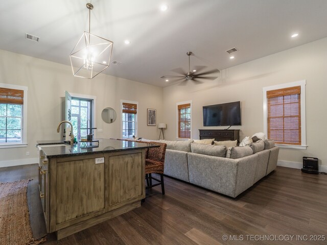 31 Park St, Carlton Landing, OK 74432 - living room featuring dark wood-style flooring, visible vents, and plenty of natural light