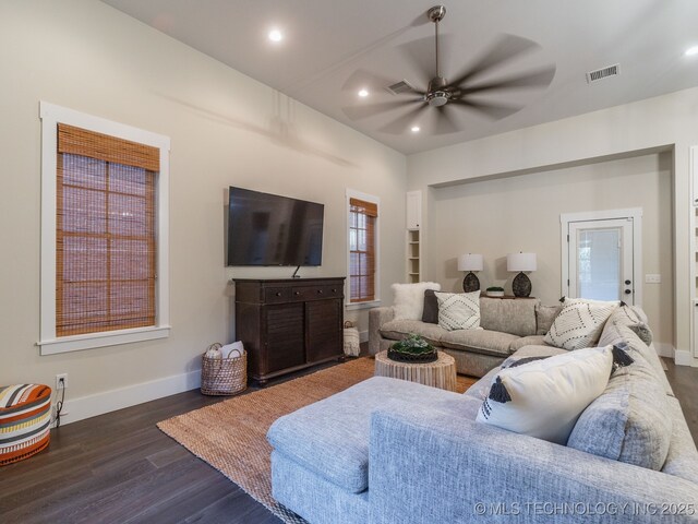 31 Park St, Carlton Landing, OK 74432 - living area featuring dark wood finished floors, visible vents, baseboards, and ceiling fan