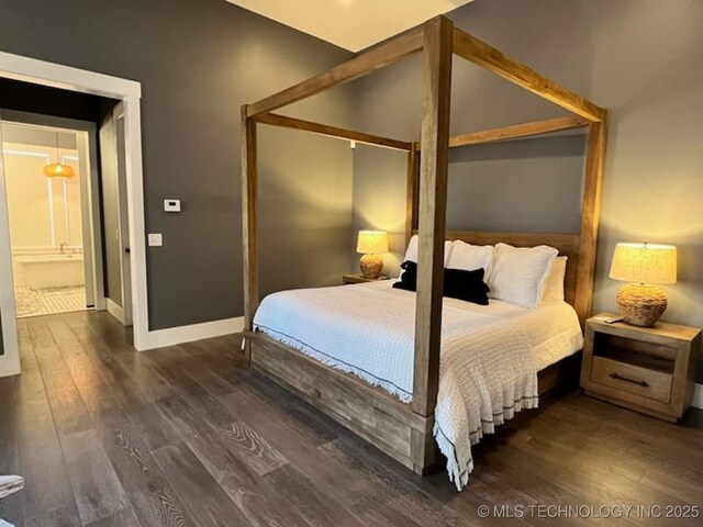 31 Park St, Carlton Landing, OK 74432 - bedroom featuring a closet, baseboards, and dark wood-style flooring