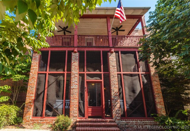 31 Park St, Carlton Landing, OK 74432 - exterior space with ceiling fan, brick siding, and a balcony